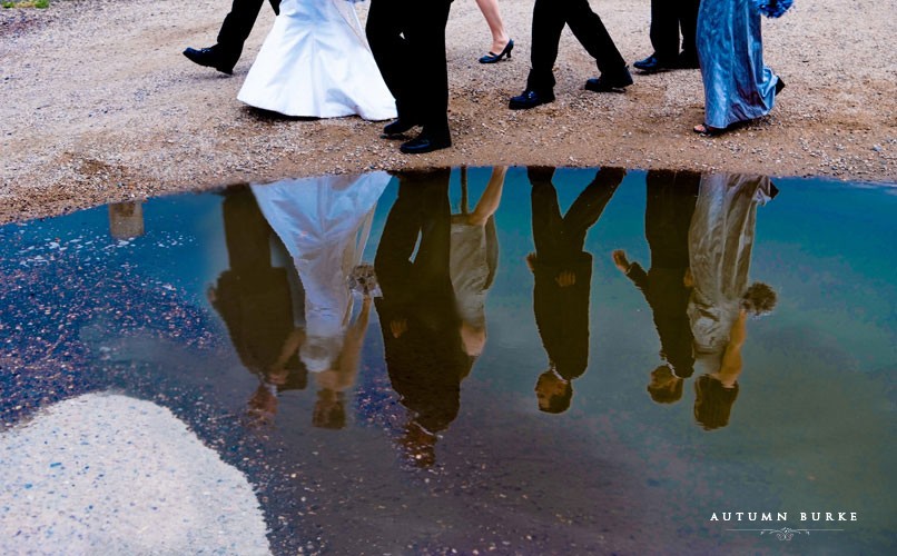 wedding party reflection in puddle